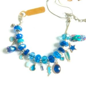 Charm bracelet 11 inches long made for the larger wrist this is beautiful blue